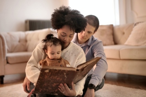 Parents reading to their child