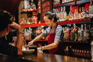 Bartender serving alcohol responsibly