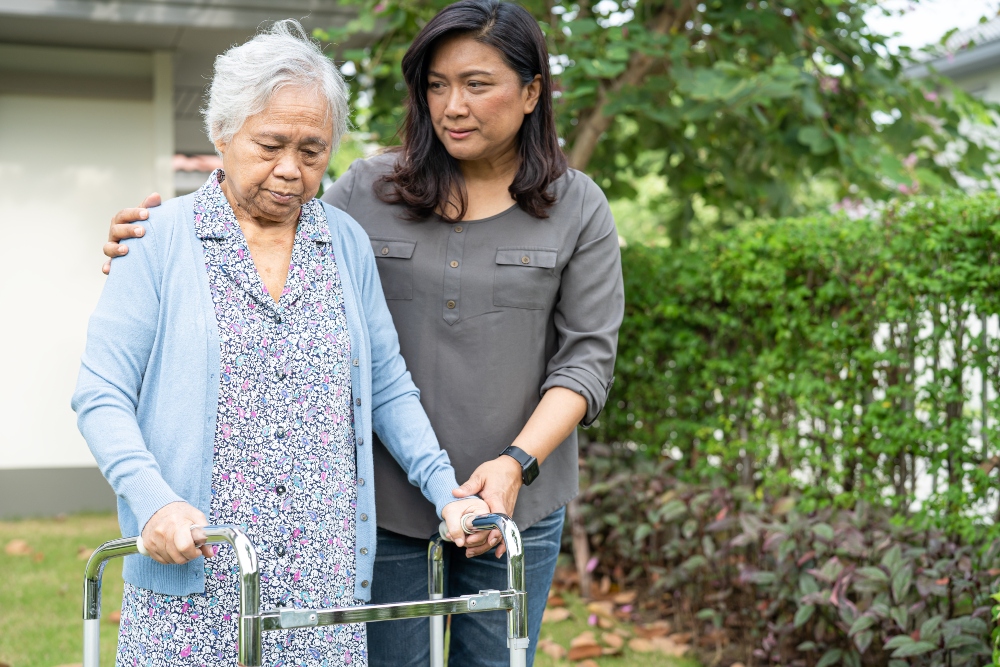 unpaid carer helping elderly